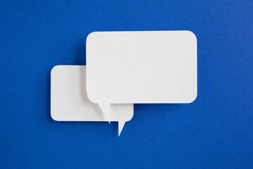 paper speech bubble on blue background