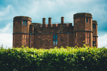 Castle tower above hedge