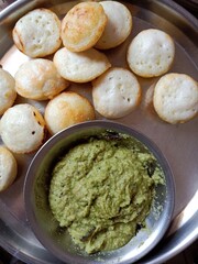 view of rice appam a Indian snack with coconut and coriander curry