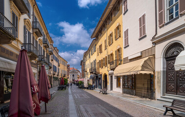 Bra, Cuneo, Piedmont, Italy - May 09, 2023: Via Cavour, central pedestrian street with the church...