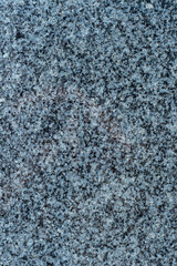 Granite background with fine texture. Cladding slabs of granite with a blue tint.