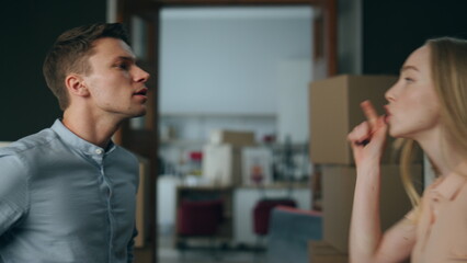 Angered wife yelling husband in new home close up. Woman quarrelling with man.