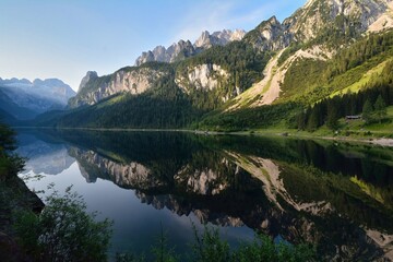 View of Gossausee. Reflection of the mountains in the lake. Austria, Europe.