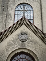 The symbol of the Holy Trinity on the facade of the church above the entrance