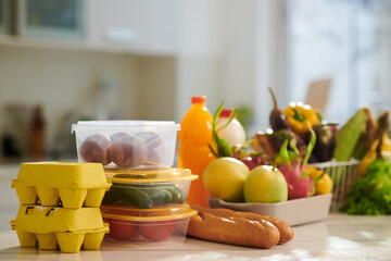 Fresh organic groceries delivered from supermarket on kitchen counter