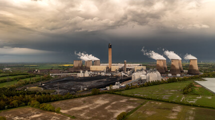 Fototapeta na wymiar Aerial landscape view of coal fired Power Station with pollution emissions