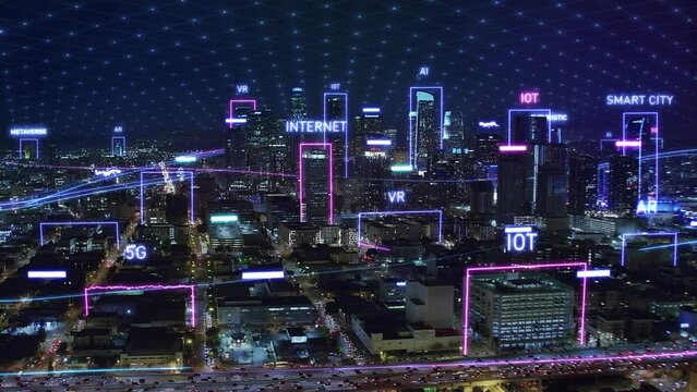 Futuristic Aerial Smart city IOT internet of things. Digital Technology, Shinning Wired Network over City. Great View of Los Angeles Skyscrapers at Dusk. Metaverse, 5G, AI, AR, NFT.
