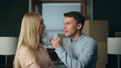 Abusive boyfriend shouting girlfriend at new home close up. Man swearing woman.
