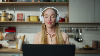 Woman freelancer dancing laptop in headphones close up. Girl resting from work.