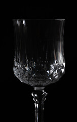 Silhouette of a crystal wine glass on a black background