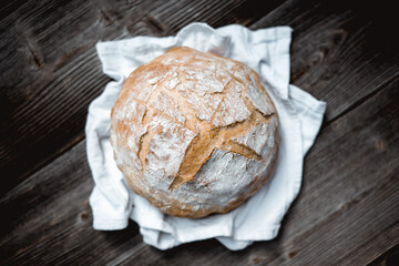 Traditional sourdough bread, characterized by its rough texture and leavening. The photo captures the essence of healthy food photography