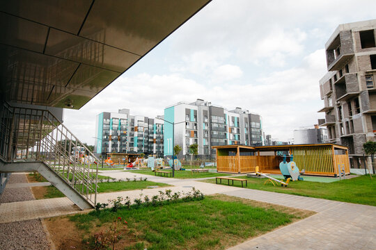 view from the territory of the children's complex to the construction site of apartments and houses with offices