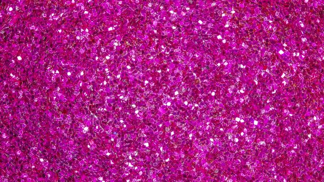 Pink sequins, spherical surface, rotating, turning, close-up macro, top view
