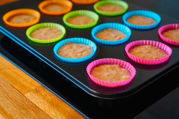 Muffin batter on a tray