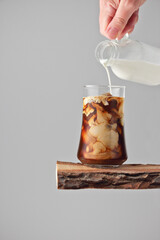 ice coffee with cream on a light background
