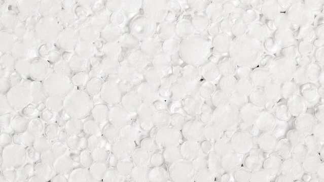 Expanded polystyrene foam small porous material white cells circle, rotating, turning, close-up macro
