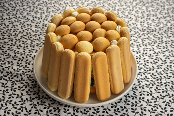 Delicious summer dessert with whipped and sour cream covered with baked sponges, tasty cold cake for hot summer days