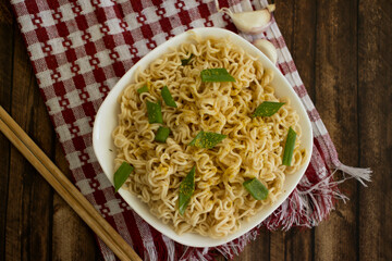 Noodles with green onions on background