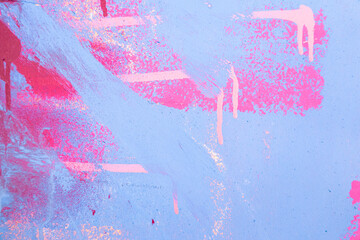 Messy paint strokes and smudges on an old painted wall. Purple, blue, pink, magenta, white drips,...