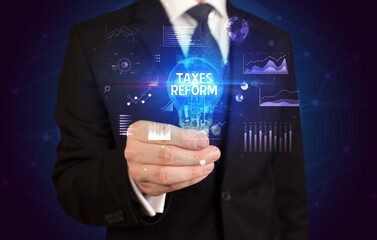 Businessman holding a light bulb, new business concept