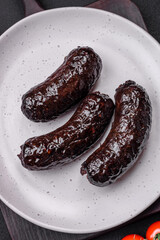 Delicious black blood sausage or black pudding with spices and herbs