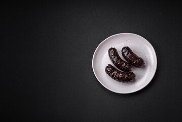 Delicious black blood sausage or black pudding with spices and herbs