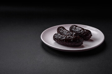 Delicious black blood sausage or black pudding with spices and herbs