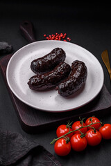 Delicious black blood sausage or black pudding with spices and herbs