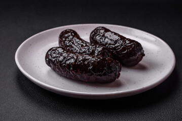 Delicious black blood sausage or black pudding with spices and herbs