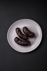 Delicious black blood sausage or black pudding with spices and herbs