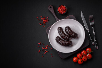 Delicious black blood sausage or black pudding with spices and herbs