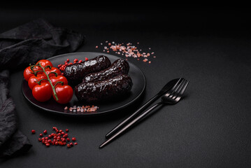 Delicious black blood sausage or black pudding with spices and herbs