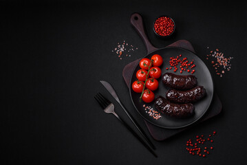 Delicious black blood sausage or black pudding with spices and herbs