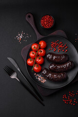 Delicious black blood sausage or black pudding with spices and herbs