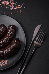 Delicious black blood sausage or black pudding with spices and herbs