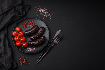 Delicious black blood sausage or black pudding with spices and herbs