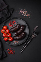 Delicious black blood sausage or black pudding with spices and herbs