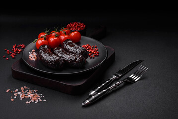 Delicious black blood sausage or black pudding with spices and herbs