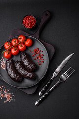 Delicious black blood sausage or black pudding with spices and herbs