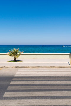 Pedestrian crossing road near the sea. Greek resort.
