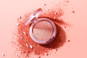 Eye shadow next to a scattering of glitter on a pink background - obrazy, fototapety, plakaty