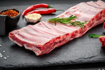 raw pork ribs on a stone background