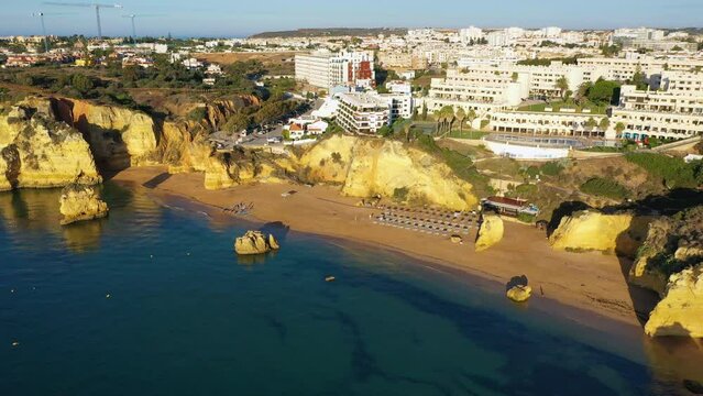 Praia de Dona Ana beach with turquoise sea water and cliffs, Portugal. Beautiful Dona Ana Beach (Praia Dona Ana) in Lagos, Algarve, Portugal. Praia de Dona Ana in Lagos in the Algarve, Portugal.