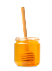 Honey in a jar with a wooden dipper on a white isolated background.