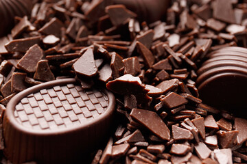 Candies in chocolate chips close-up macro photography.