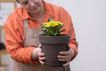 woman opening a small business plant store to share your passion for plants and help others create their own home gardens. 