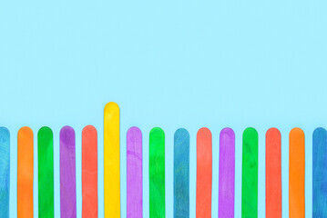 Colorful ice cream sticks on blue background