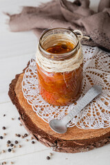 Jar of chutney on top of wood lug