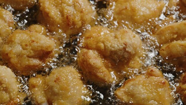 Frying chicken in plenty of oil 01