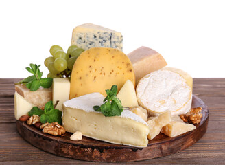 Plate with different types of tasty cheese on table against white background